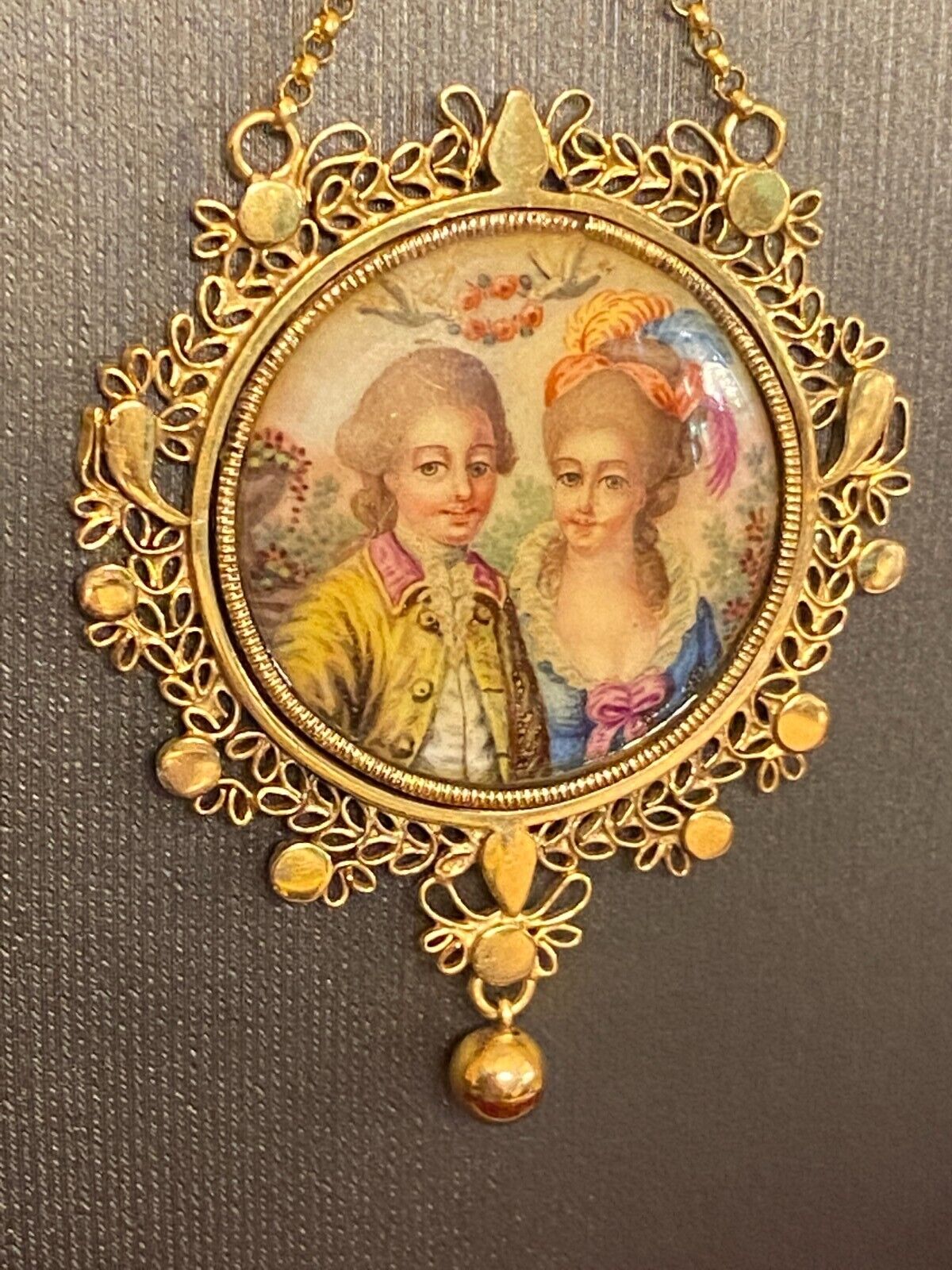 Exquisite French antique 18k gold pendant with two lovers painted on copper.