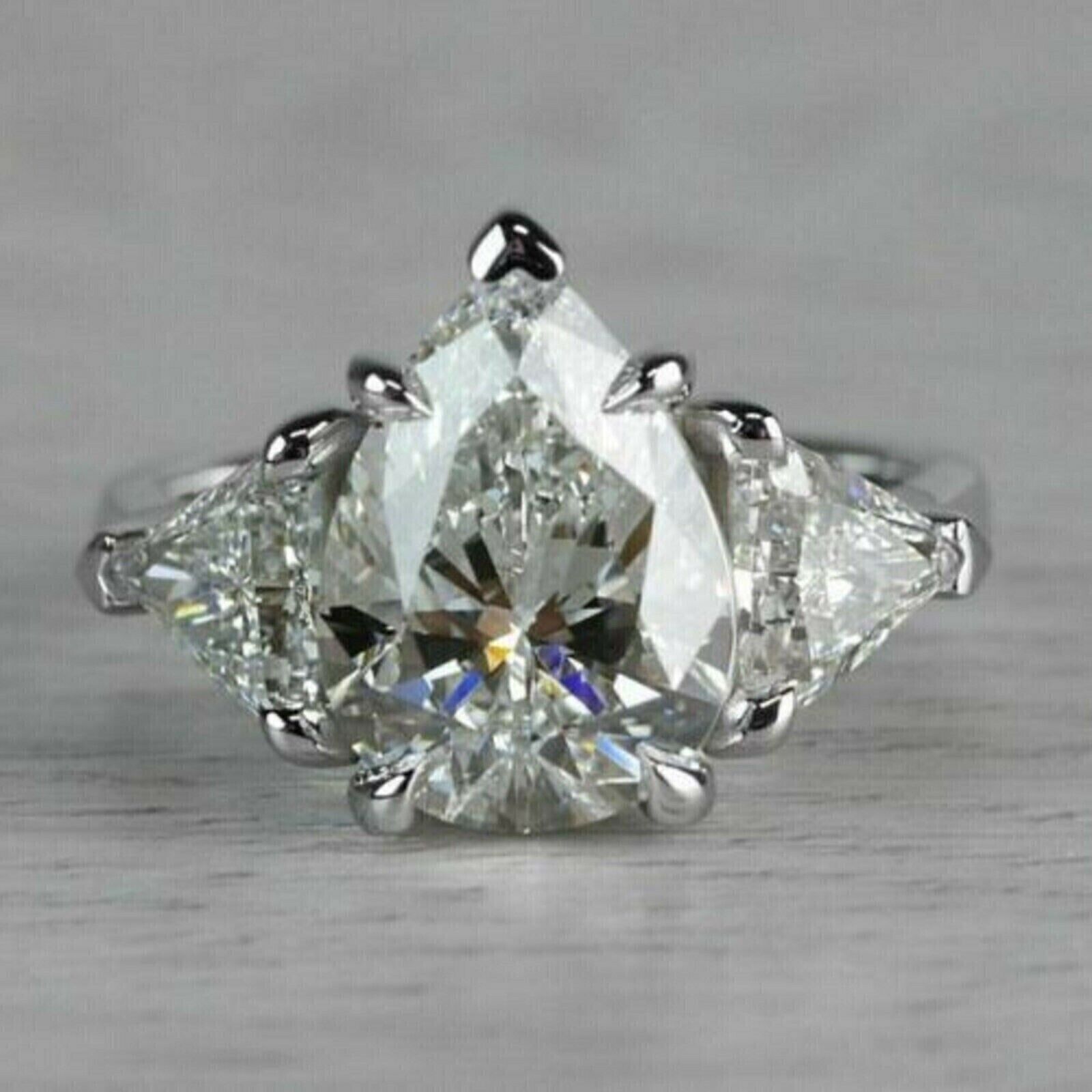 3.40 TCW Pear Cut Moissanite Three Stone Engagement Ring 14K White Gold Plated