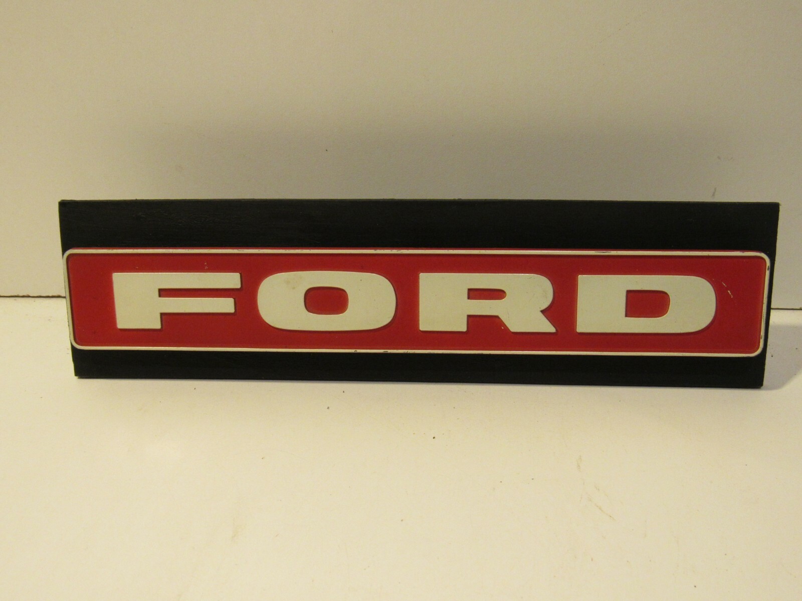 Ford Display Truck Metal Emblem Badge Vintage Trim Decal on wood Ford Display Truck Metal Emblem Badge Vintage Trim Decal on wood