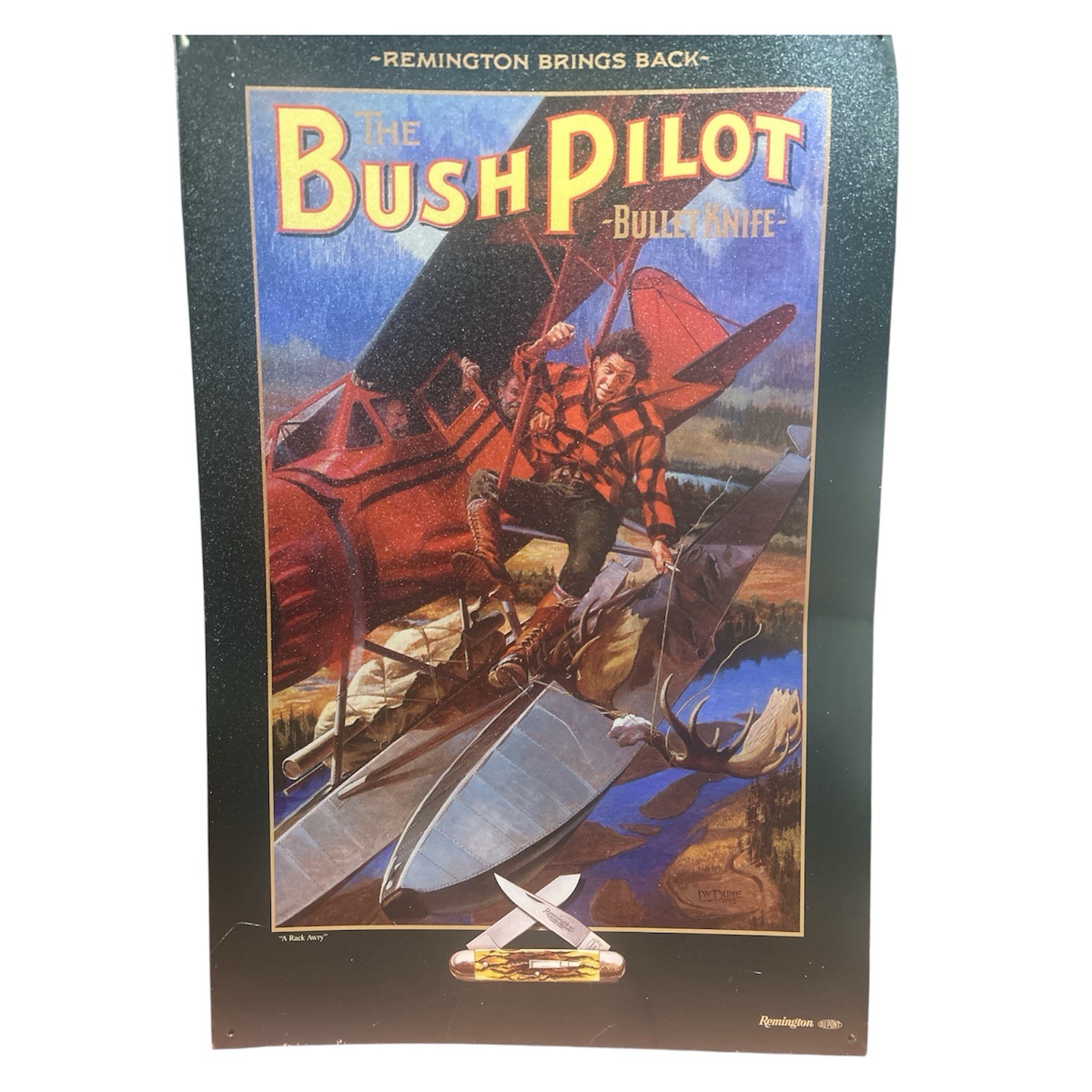 REMINGTON BUSH PILOT Bullet Knife Tin Sign A Rack Awry\' LW DUKE 1992