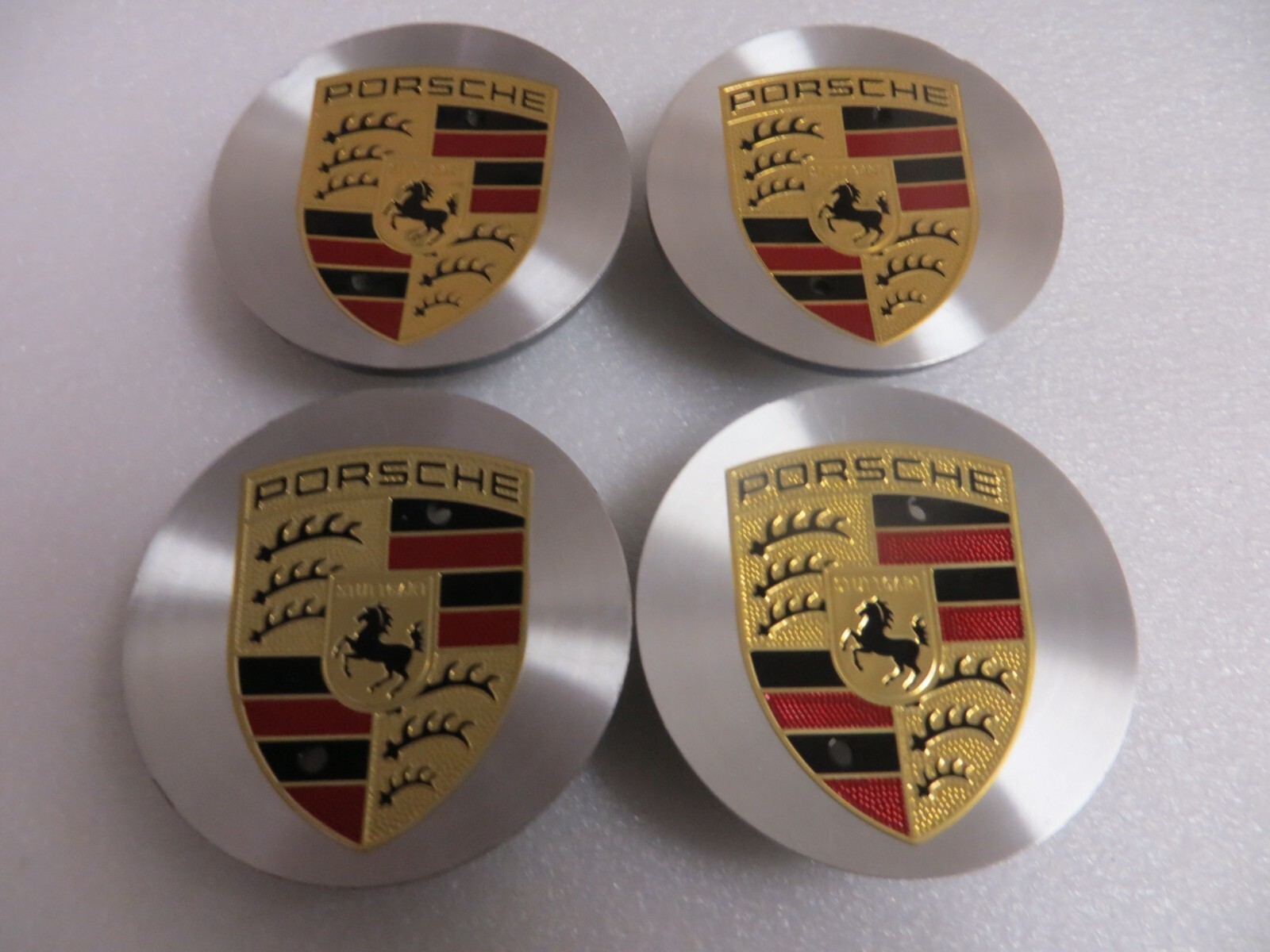 New PORSCHE SILVER MACHINED / GOLD & BLACK EMBLEM CENTER CAPS - SET OF 4 - OEM