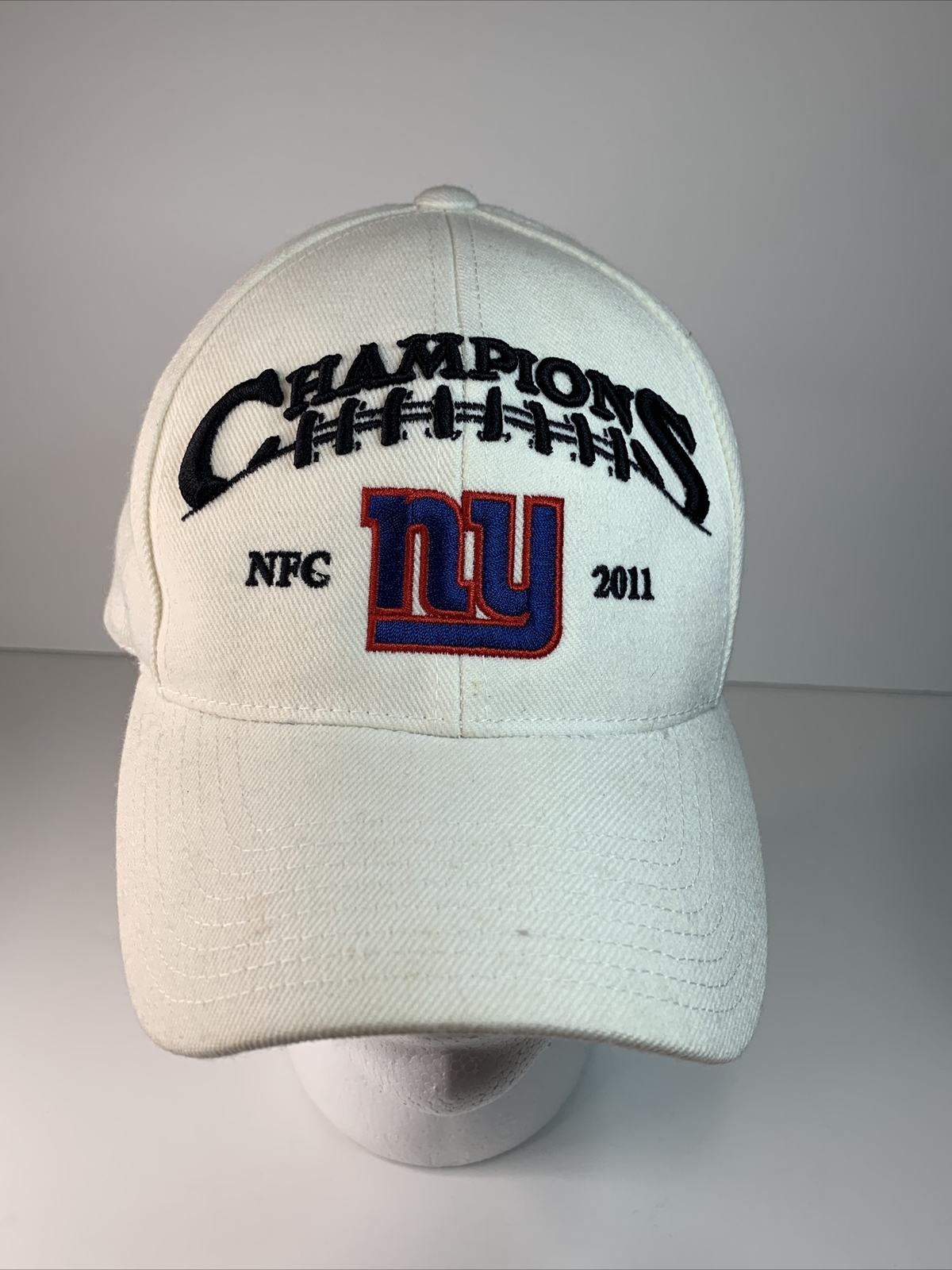 NEW YORK NY GIANTS WHITE REEBOK NFL - NFC CONFERENCE 2011 CHAMPIONS HAT (G5) NEW YORK NY GIANTS WHITE REEBOK NFL - NFC CONFERENCE 2011 CHAMPIONS HAT (G5)