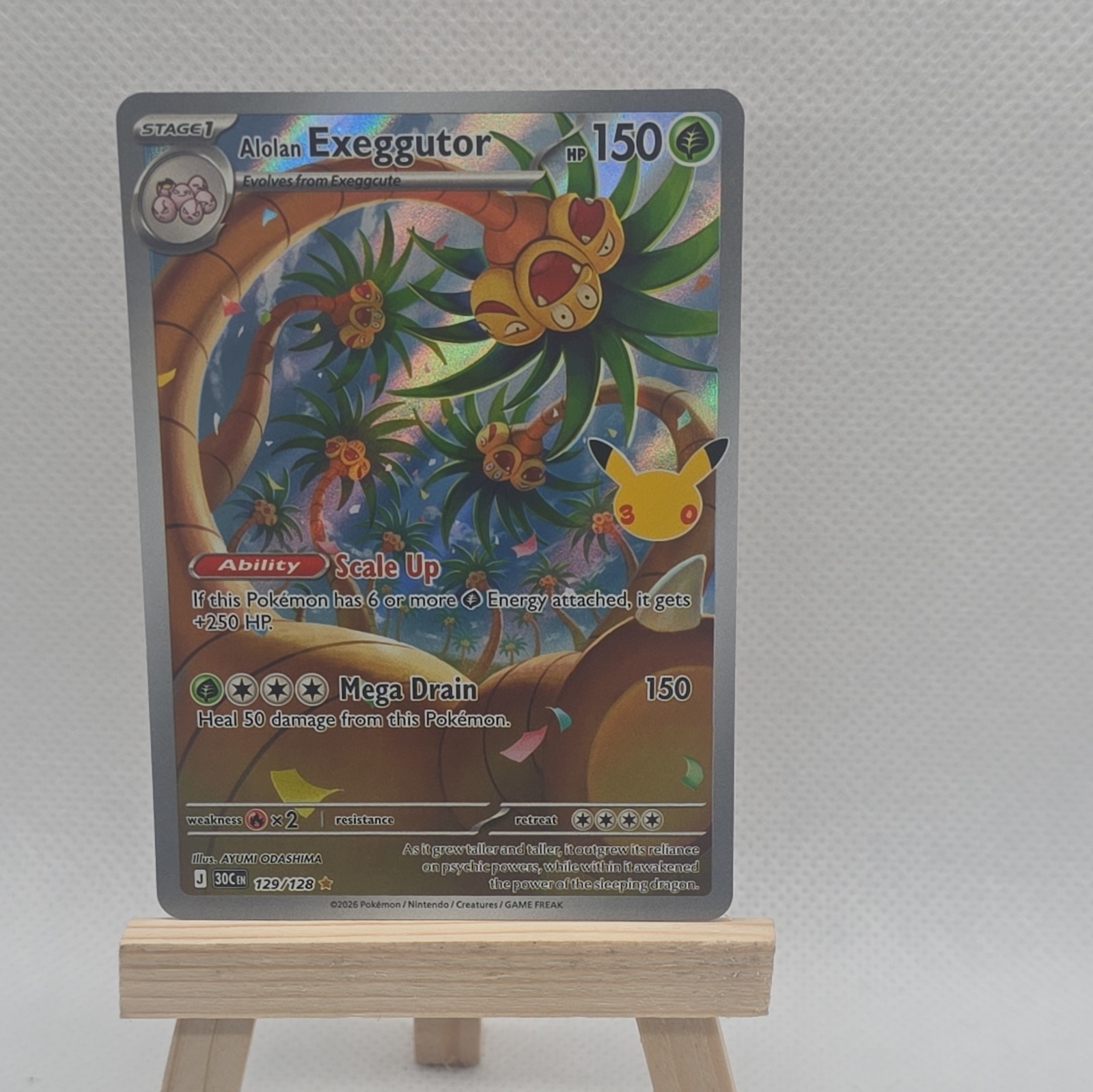 Alolan Exeggutor 129/128 Me: 30th Celebration Holo Alolan Exeggutor 129/128 Me: 30th Celebration Holo