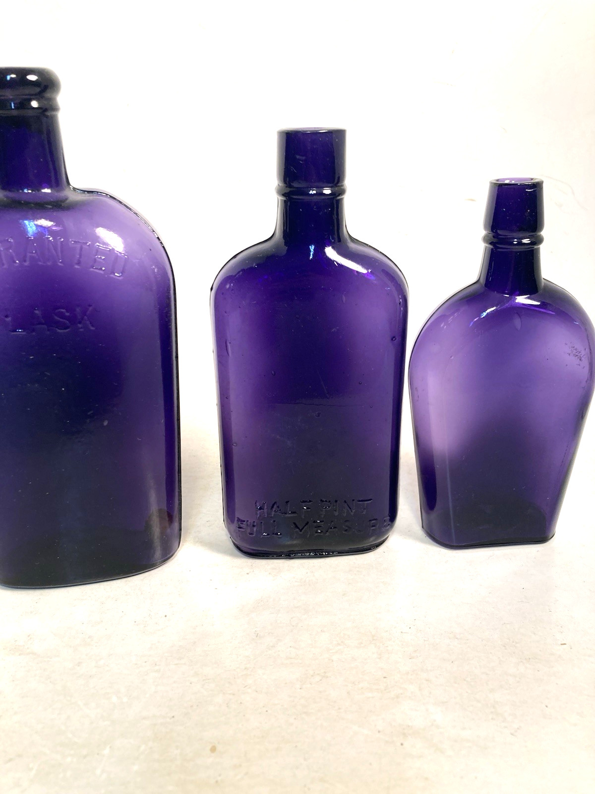 Vintage Purple Glass Whiskey Bottles, 2 EMBOSSED, 1 NOT, NOT DUG bottles
