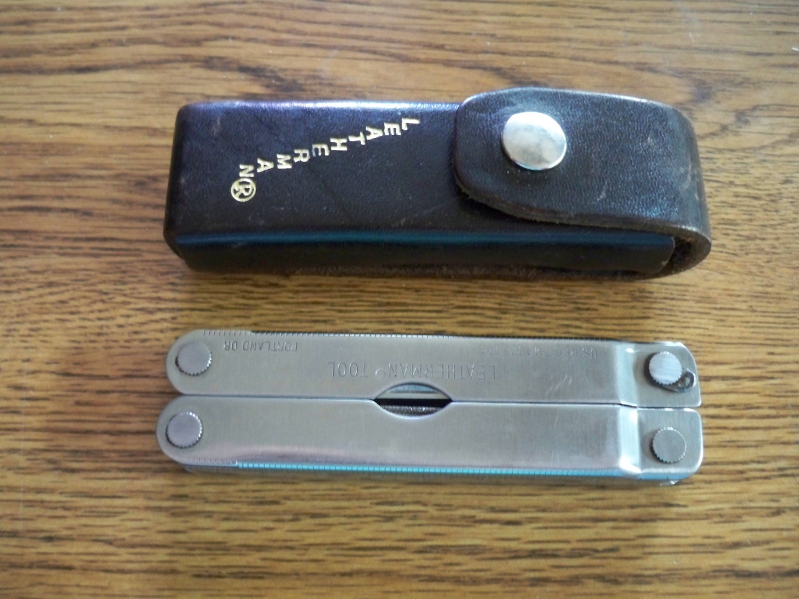 ORIGINAL LEATHERMAN MULTI TOOL WITH LEATHER SHEATH. DATE STAMPS  1-95 & 3-95.