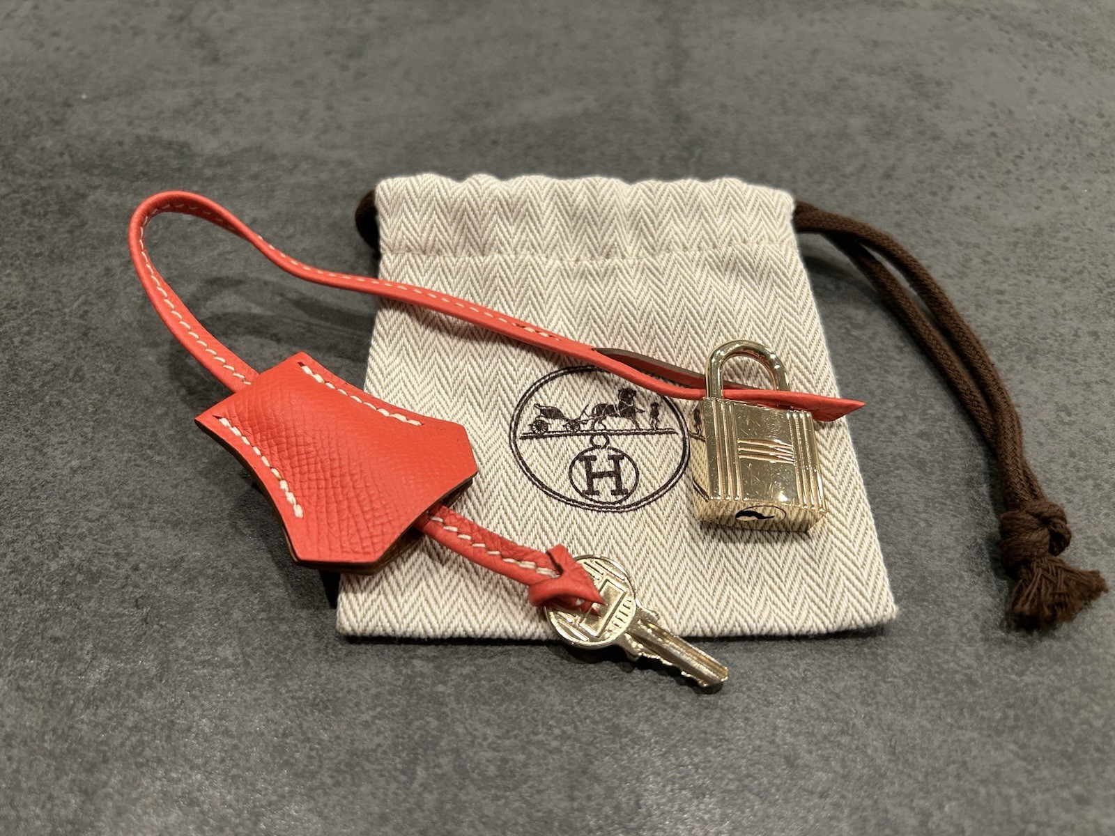 Hermes Gold Cadena Lock 114 w/Key Red Clochette Dust Bag Authentic