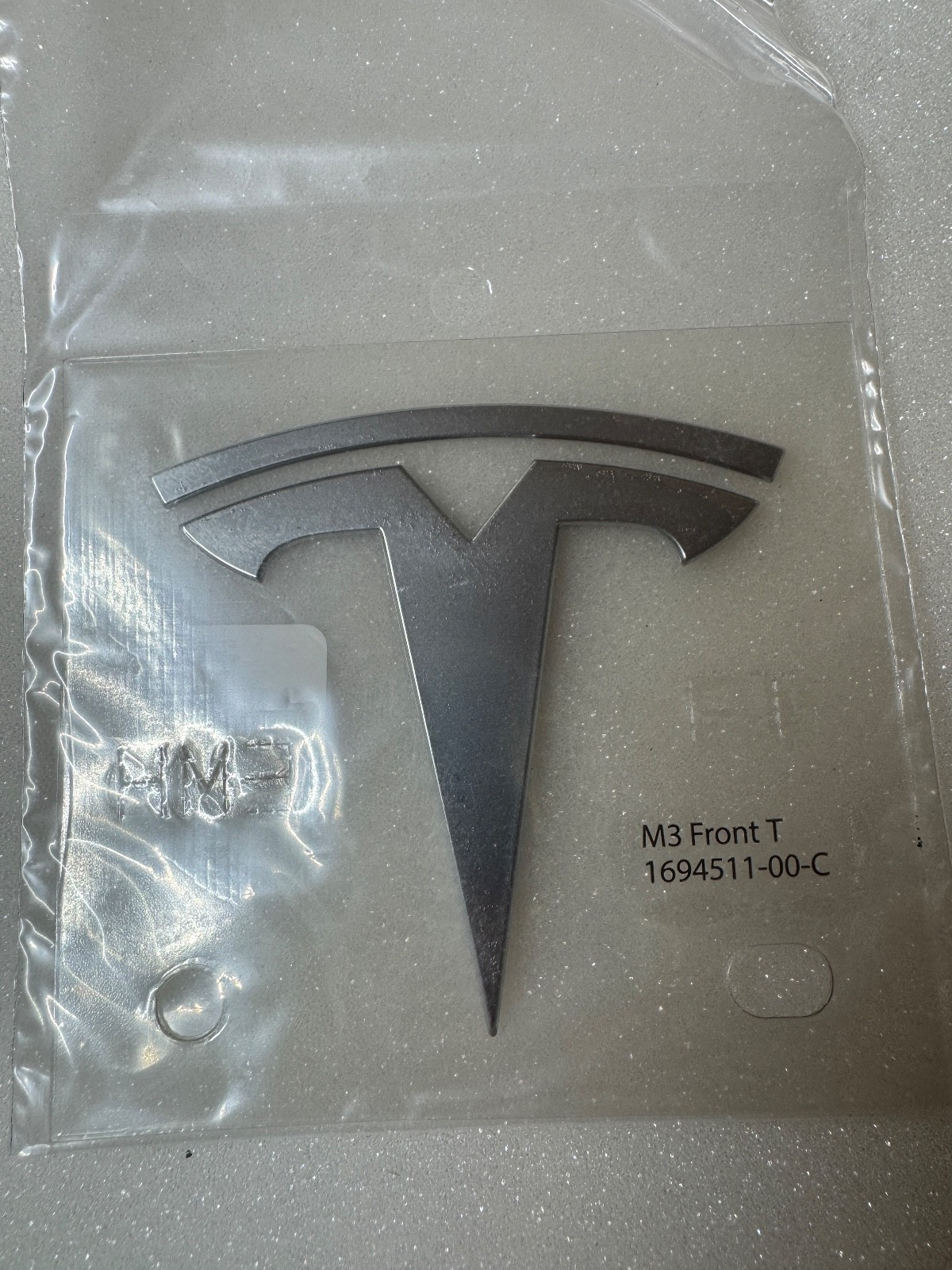 NEW OEM 24-26 Genuine Tesla model 3 Front T-Badge chrome 1694511-00-C NEW OEM 24-26 Genuine Tesla model 3 Front T-Badge chrome 1694511-00-C