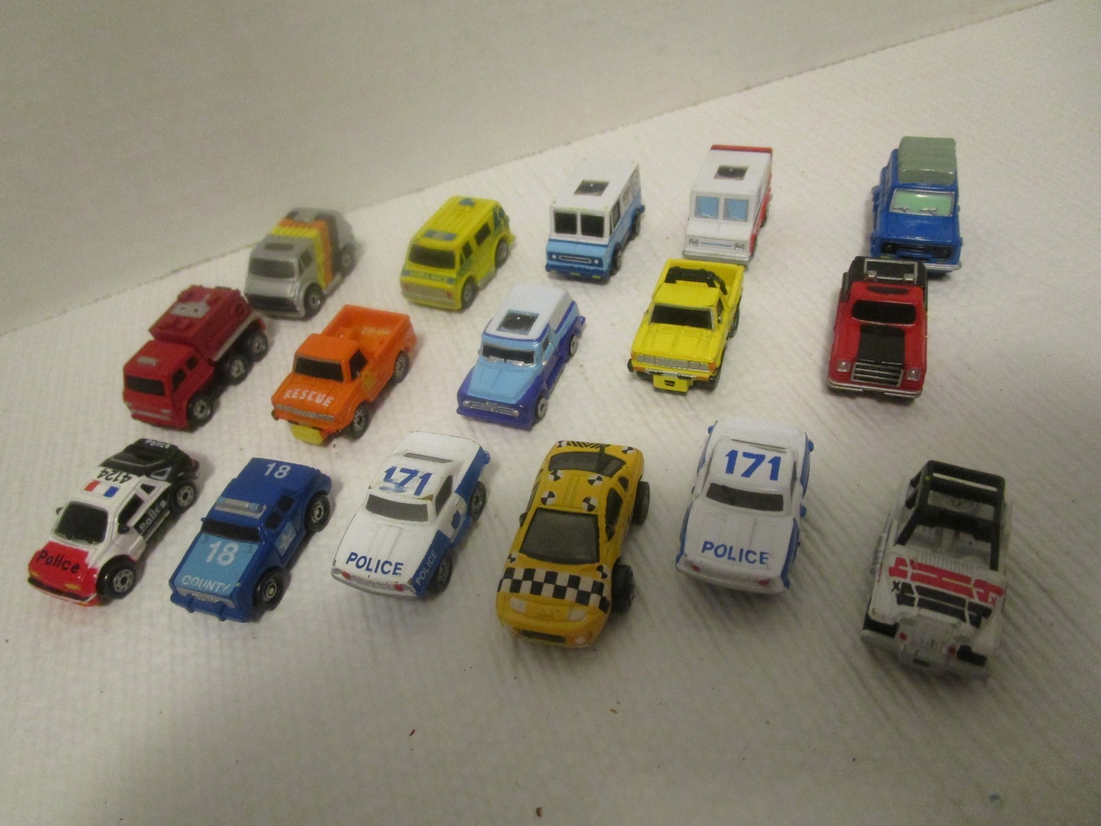Micro Machines Lot of 16 Vehicles Police Cars, Taxi, Vans, Jeep, Trucks & SUVs Micro Machines Lot of 16 Vehicles Police Cars, Taxi, Vans, Jeep, Trucks & SUVs