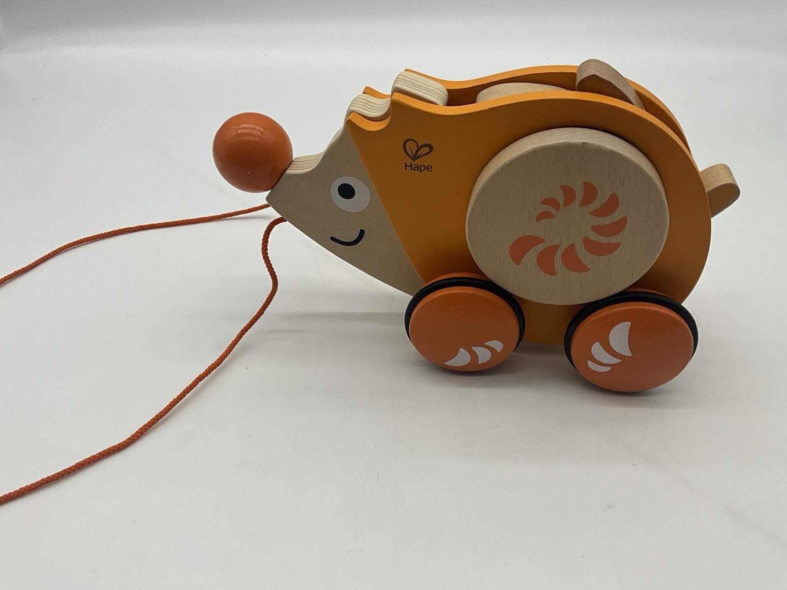 Hape Walk-A-Long Hedgehog Orange Wooden Pull Toy With Rubber Rimmed Wheels Hape Walk-A-Long Hedgehog Orange Wooden Pull Toy With Rubber Rimmed Wheels