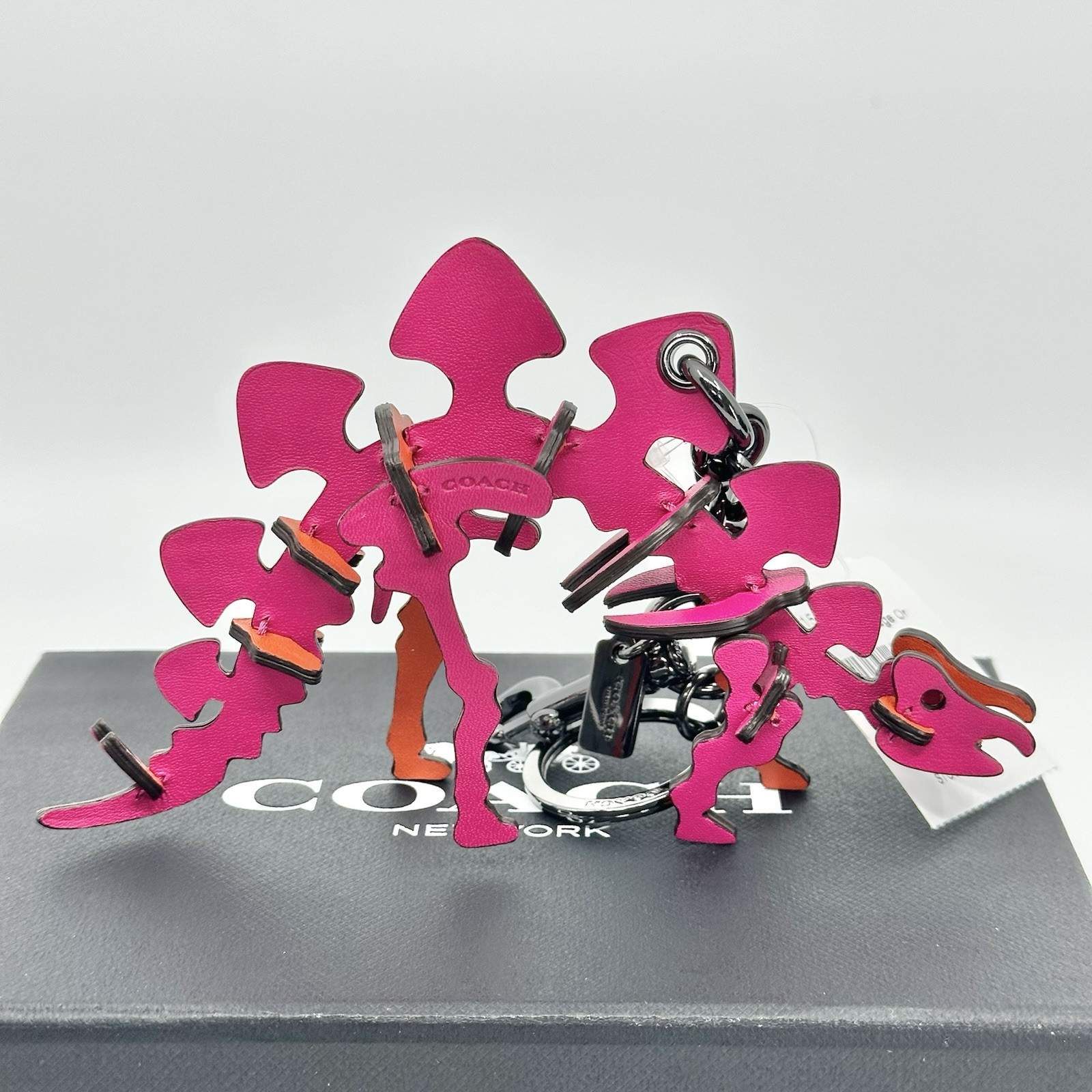 NEW WITH TAGS COACH STEGGY PUZZLE HOT PINK/ORANGE LEATHER KEY RING BAG CHARM NEW WITH TAGS COACH STEGGY PUZZLE HOT PINK/ORANGE LEATHER KEY RING BAG CHARM