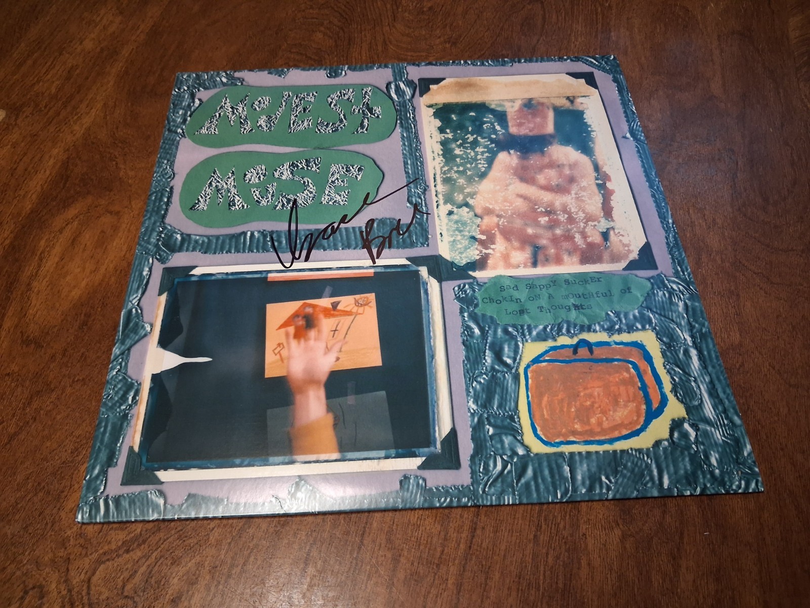 Isaac Brock autographed Modest Mouse Sad Sappy Sucker Album Cover