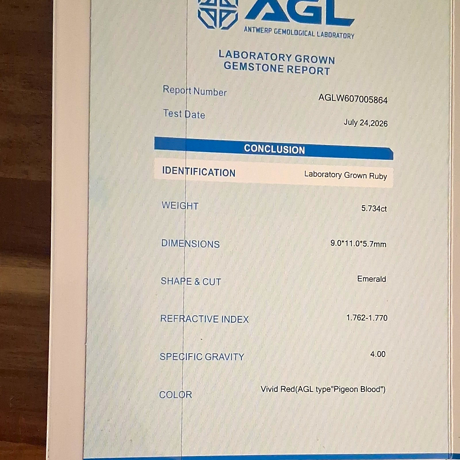 AGL Certified Lab-Created Ruby 5.734ct Vivid Red Emerald Cut 11x9x5.7mm AGL Certified Lab-Created Ruby 5.734ct Vivid Red Emerald Cut 11x9x5.7mm