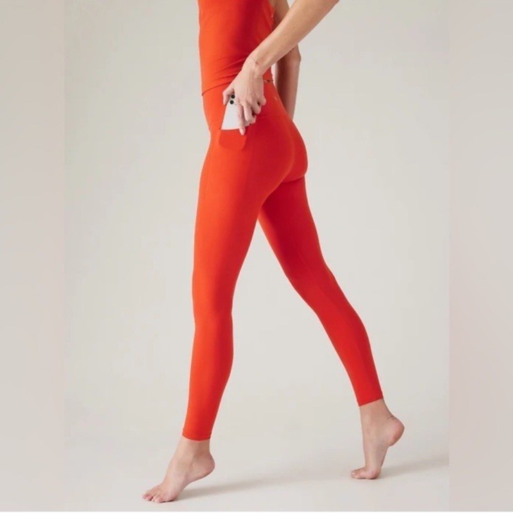 Athleta Transcend Stash Tight with Pockets Larkspur Red (orange) medium leggings
