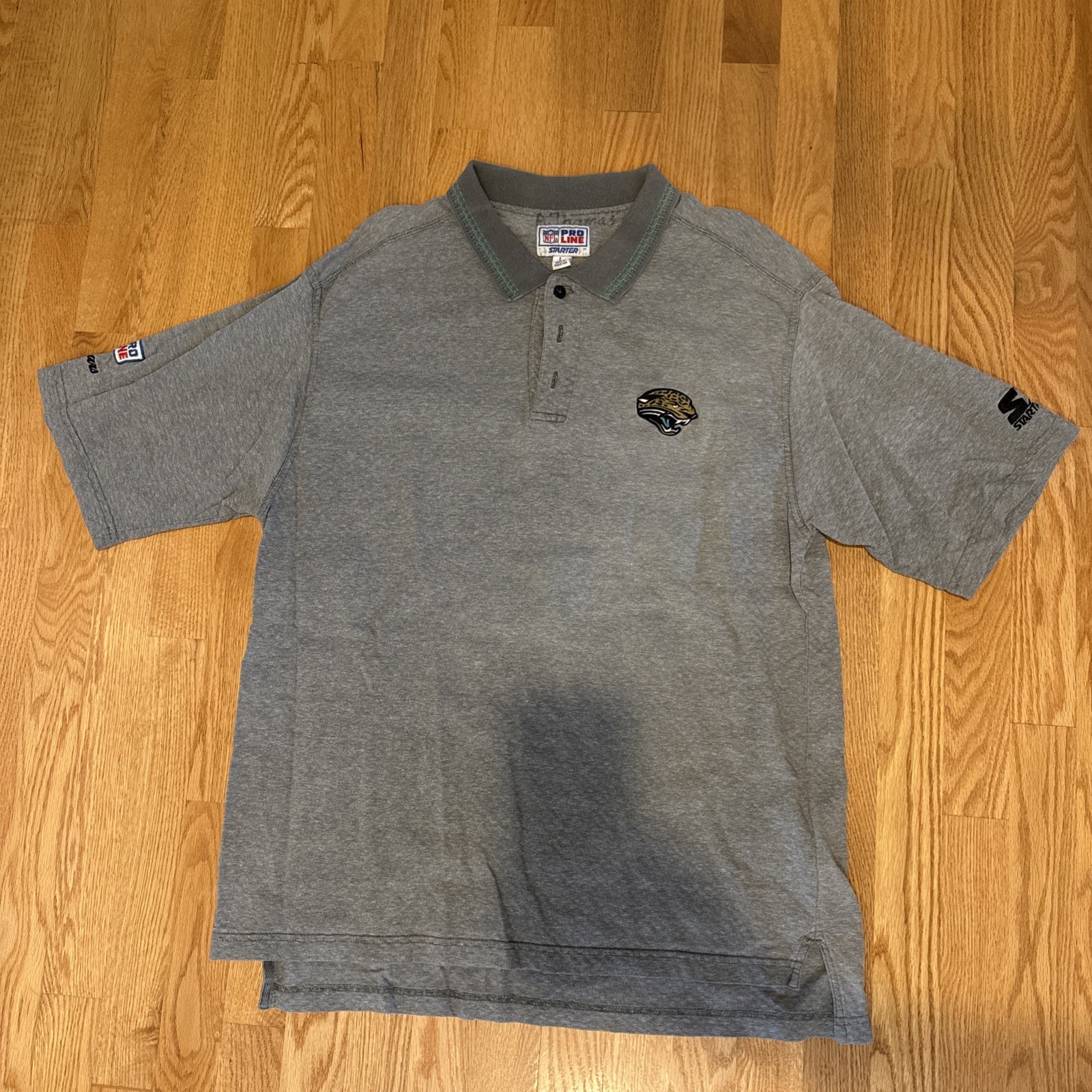 Vintage Starter x NFL Jacksonville Jaguars Men’s large 1990s Cotton Polo Shirt Vintage Starter x NFL Jacksonville Jaguars Men’s large 1990s Cotton Polo Shirt