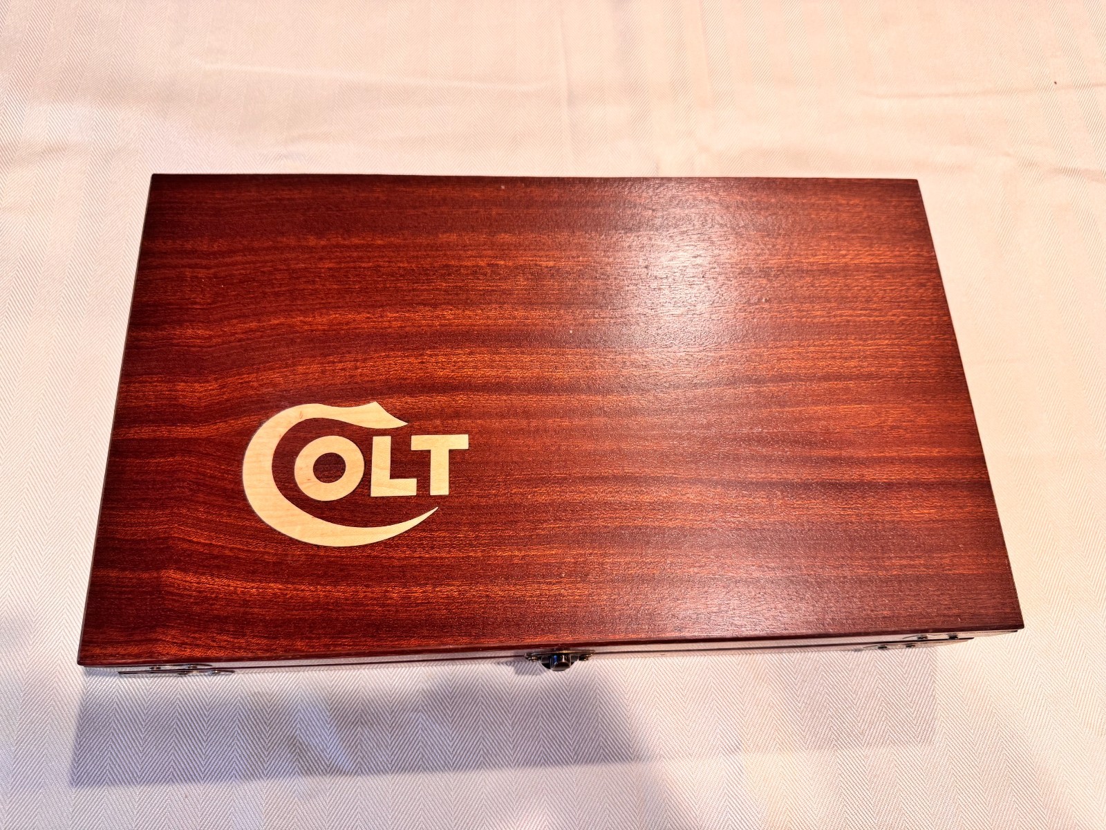 Hand Crafted Colt Mahogany Solid wood boxes with inlay and metal corners.