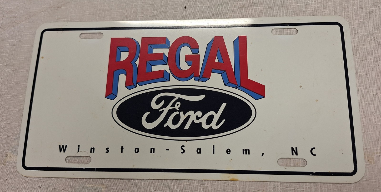 Vintage Regal Ford Winston Salem NC Metal License Plate Tag Red,White,Blue,Black