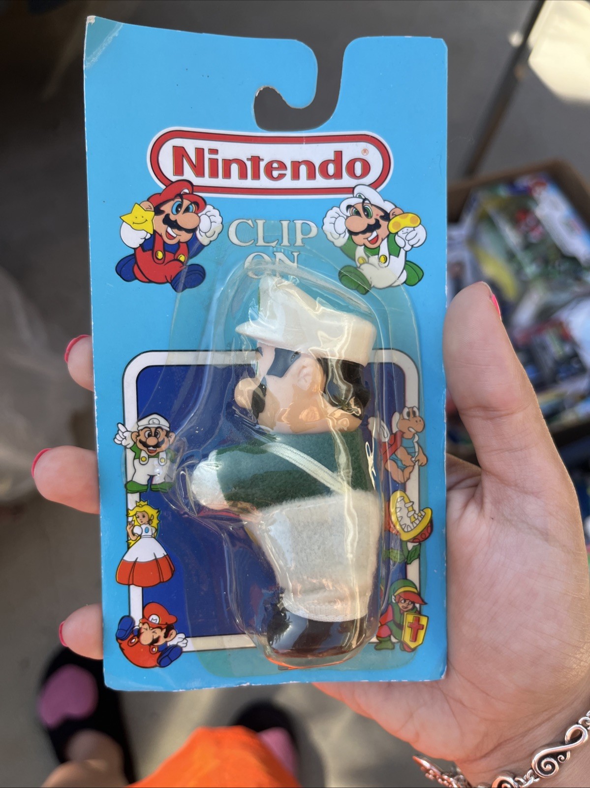 This item is a vintage 1988/1989 Nintendo of America Luigi Clip-On Figure