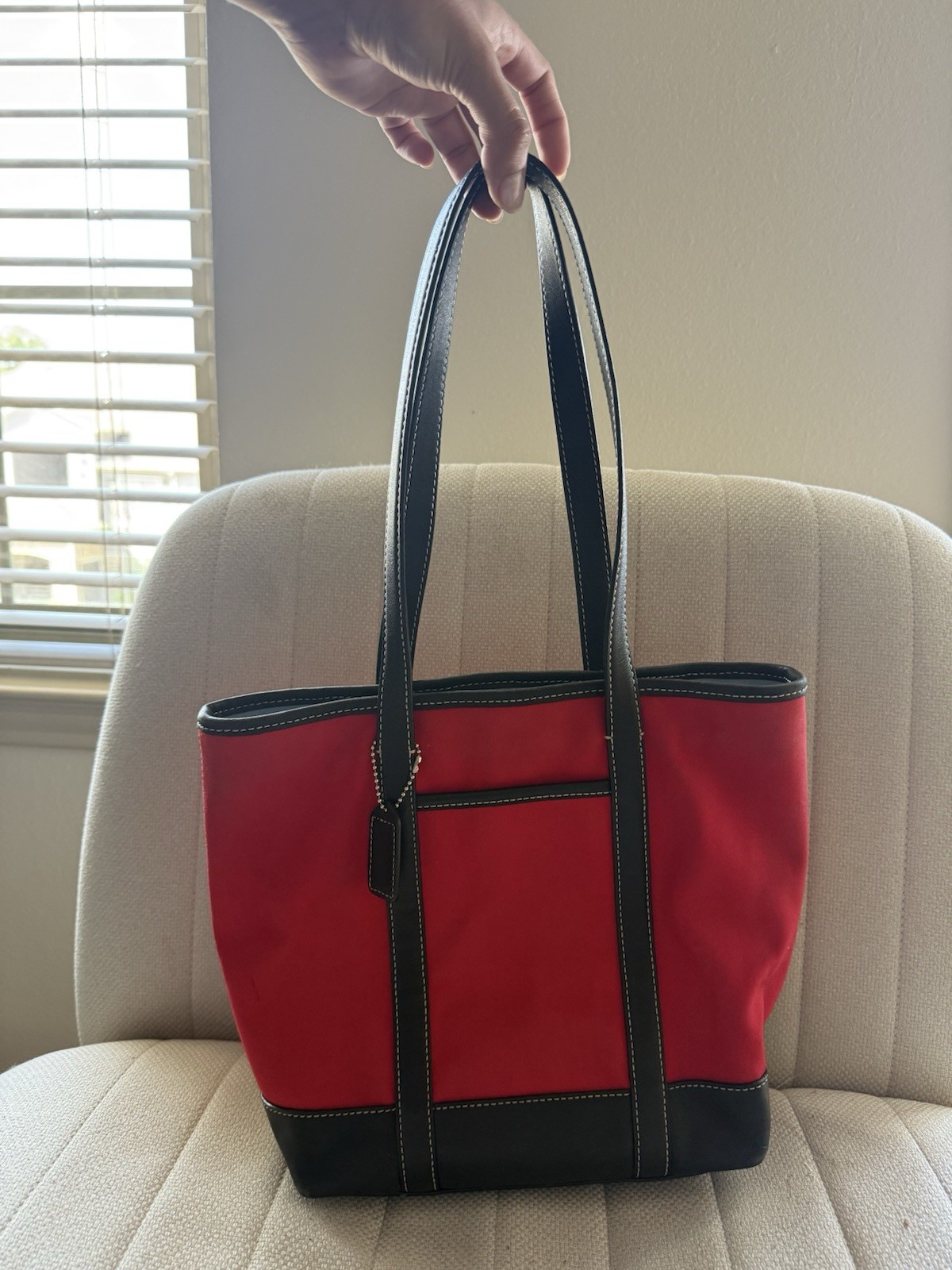 Vintage Coach small tote red canvas with black leather trim and a blue interior.