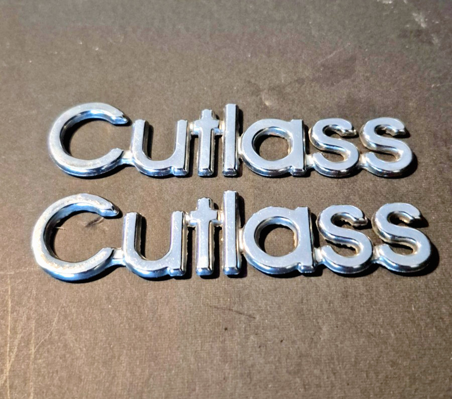 Vintage 1971-1977 Oldsmobile Cutlass Script Emblems – Pair – 3-3/4” Vintage 1971-1977 Oldsmobile Cutlass Script Emblems – Pair – 3-3/4”