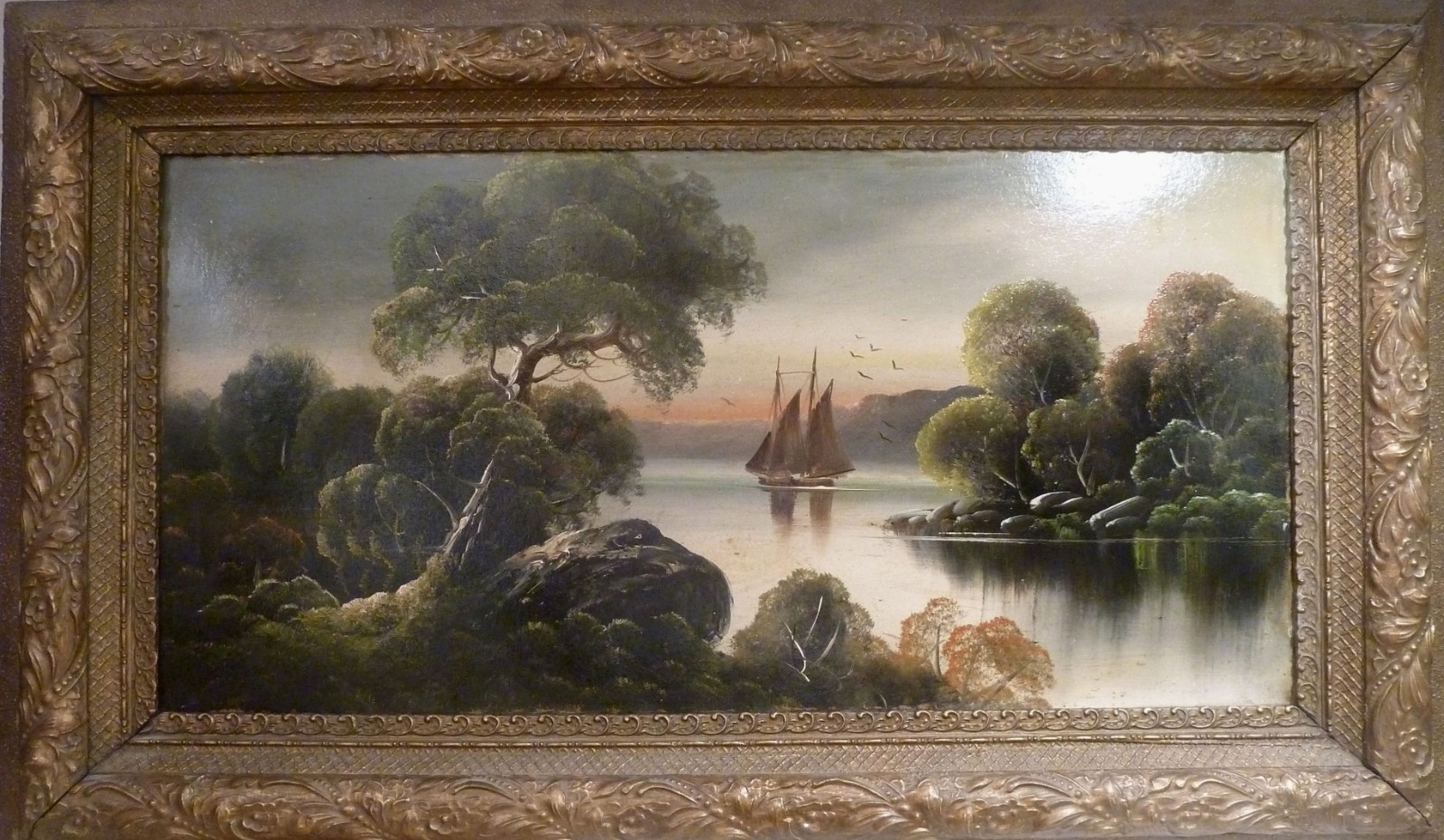 UNSIGNED BRITISH ARTIST SAILING SHIP ON THE LAKE AT SUNSET.
