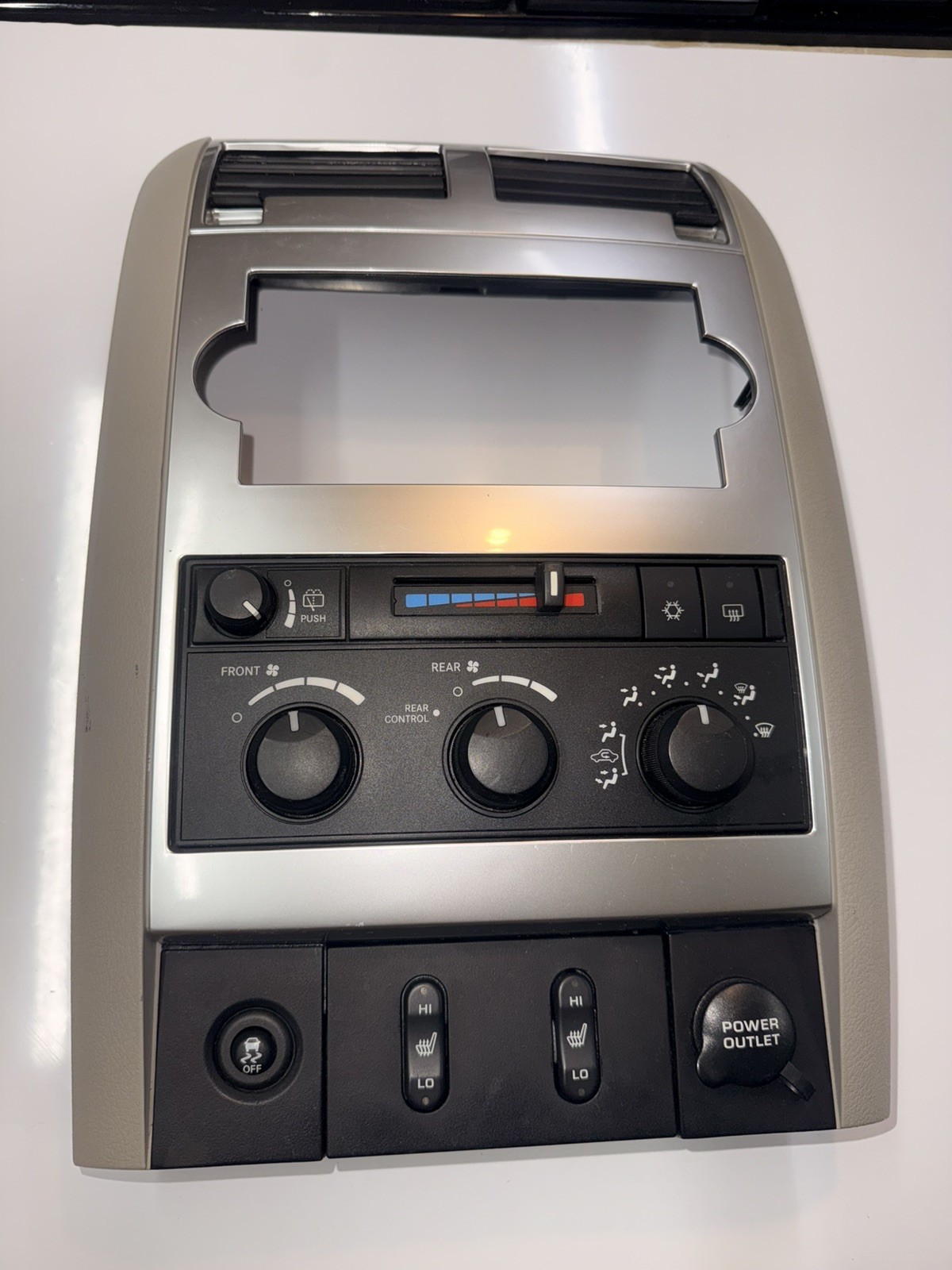 04-09 Dodge Durango Radio Bezel With Climate Control Heated Seat Silver/Gray 04-09 Dodge Durango Radio Bezel With Climate Control Heated Seat Silver/Gray