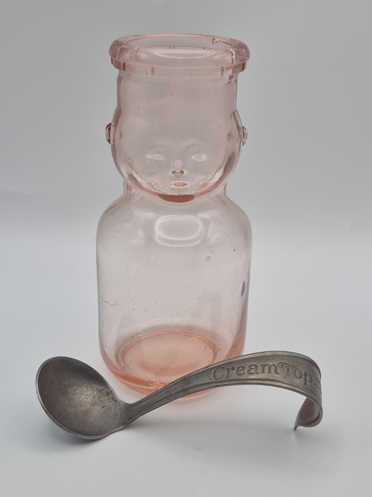 Vintage Brookfield Pink Baby Half Pint Milk Bottle With Separator Spoon. Vintage Brookfield Pink Baby Half Pint Milk Bottle With Separator Spoon.