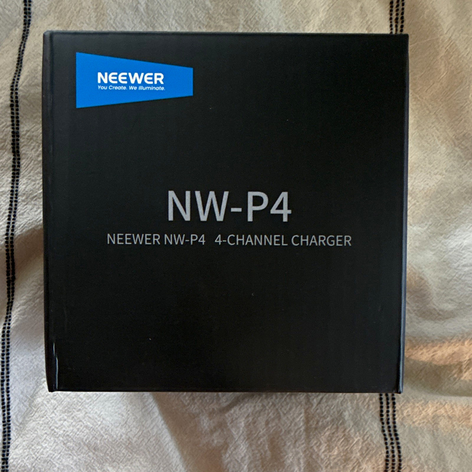 Neewer NW-P4 4-Channel 45W Charger for Canon EOS LP-E6 Li-Ion Batteries Neewer NW-P4 4-Channel 45W Charger for Canon EOS LP-E6 Li-Ion Batteries