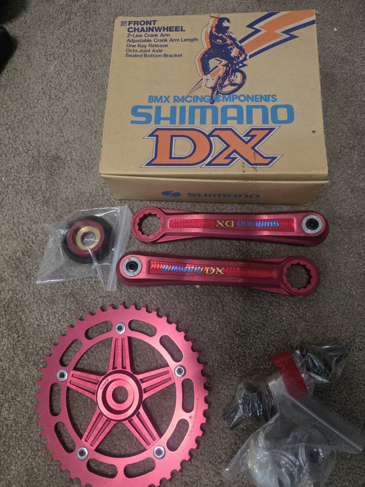 old school NOS 1980s Red Shimano DX 3 piece cranks in the box BMX bike