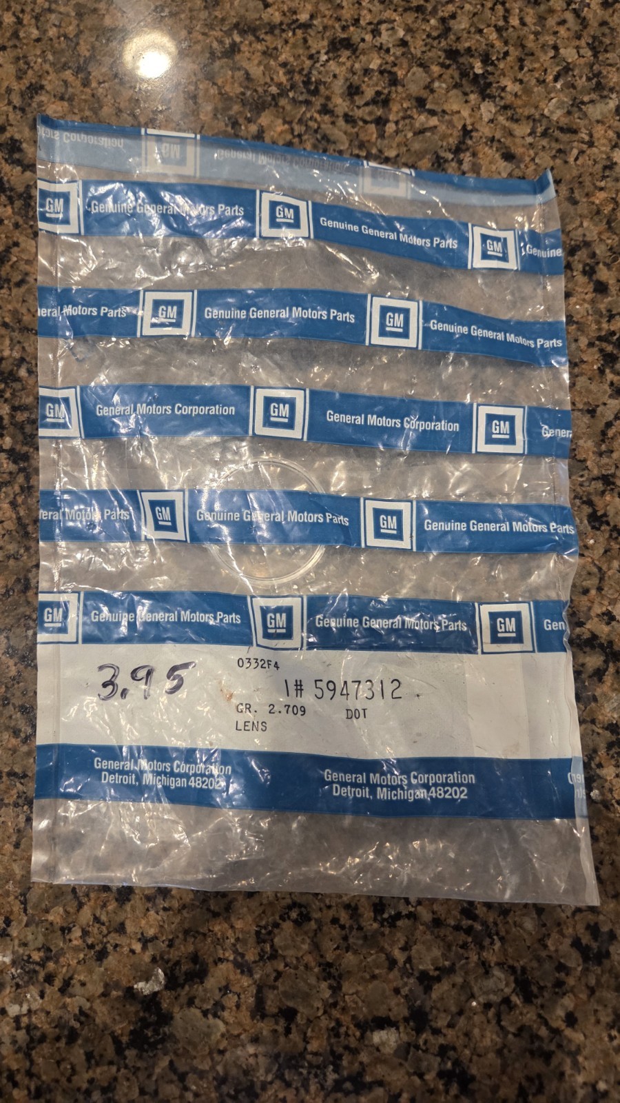 GM NOS  5947312  rear license plate light lens