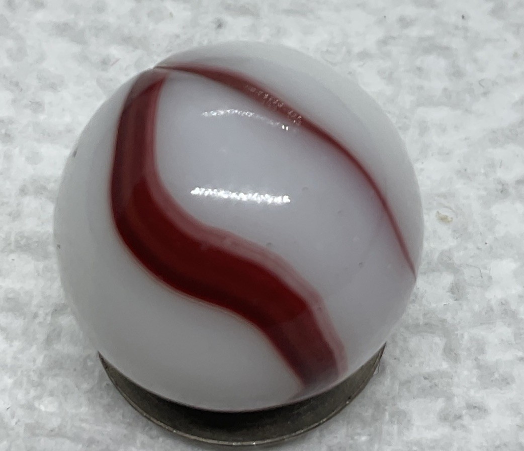 A Akro Agate Opaque Oxblood Swirl Marble. .62” In Mint Condition.
