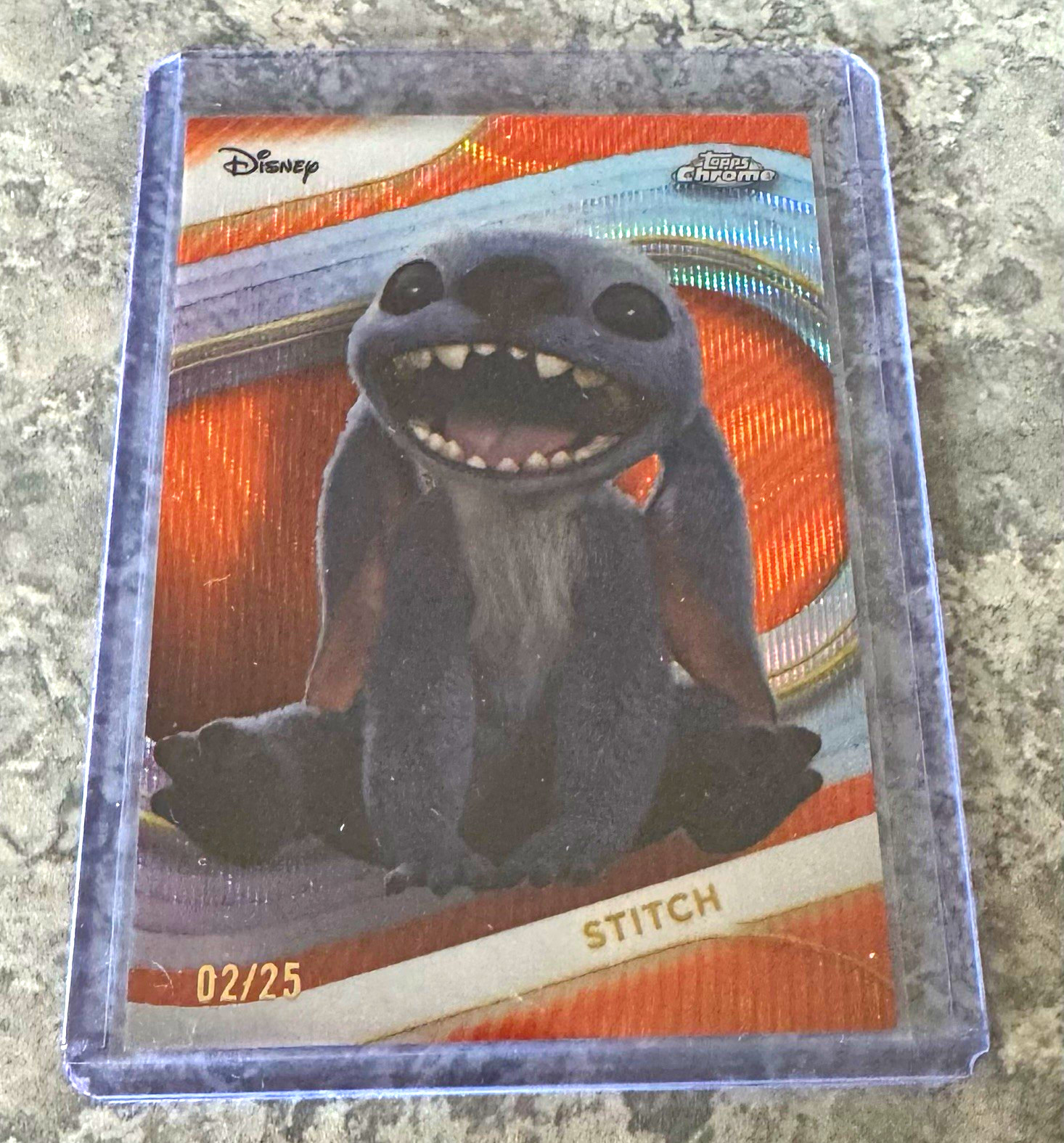 Topps 2025 Topps Chrome Disney Stitch #200 orange wave refractor 02/25 Topps 2025 Topps Chrome Disney Stitch #200 orange wave refractor 02/25