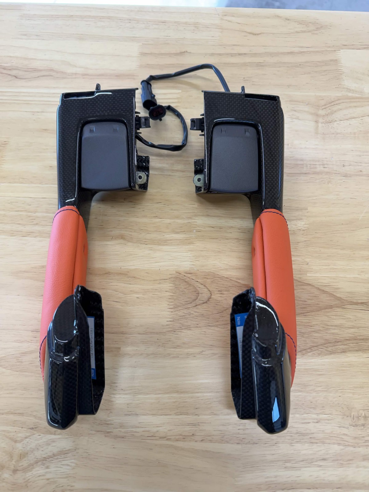 OEM FERRARI F8 Carbon Fiber Interior Door Handles, with orange/blue trim