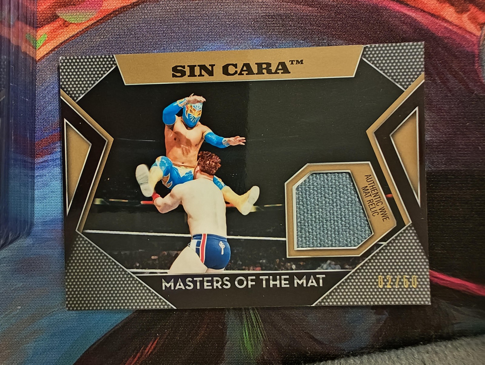 2011 Topps WWE #NNO Sin Cara Masters of the Mat Relics Gold #/50