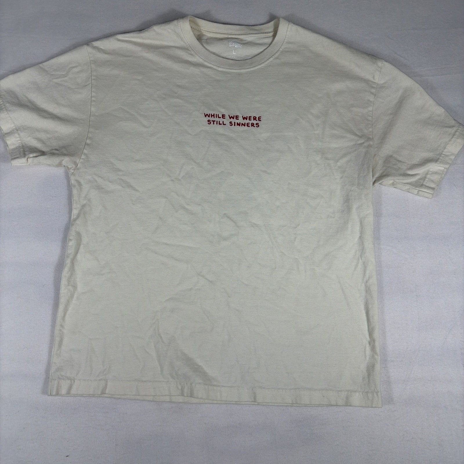 Proclamation Coalition Tshirt Romans 5:6-8 Men’s Cream Shirt L