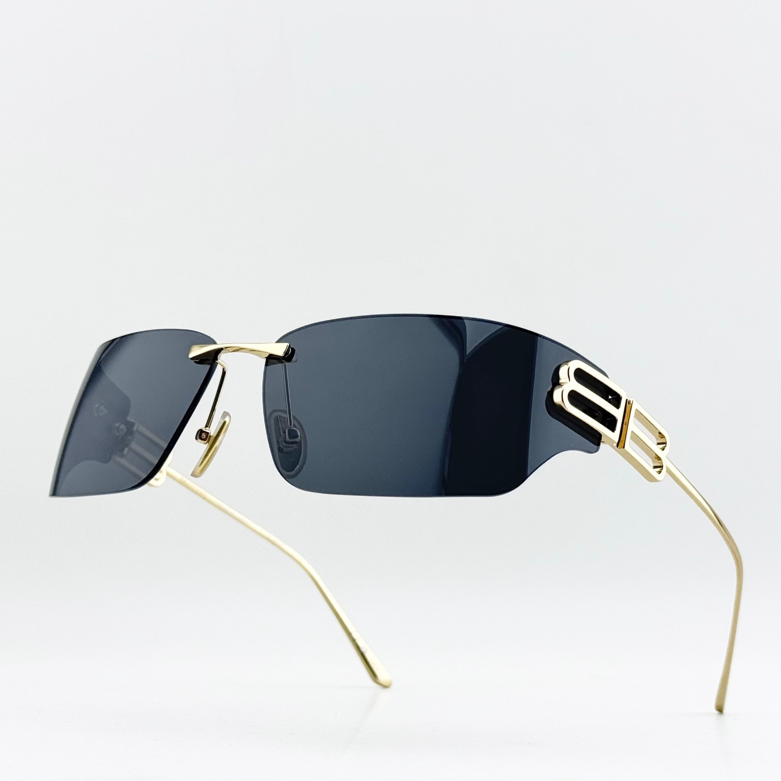 Balenciaga BB0485SA Rimless Gold Frame Black Lens Rectangle Sunglasses 76mm