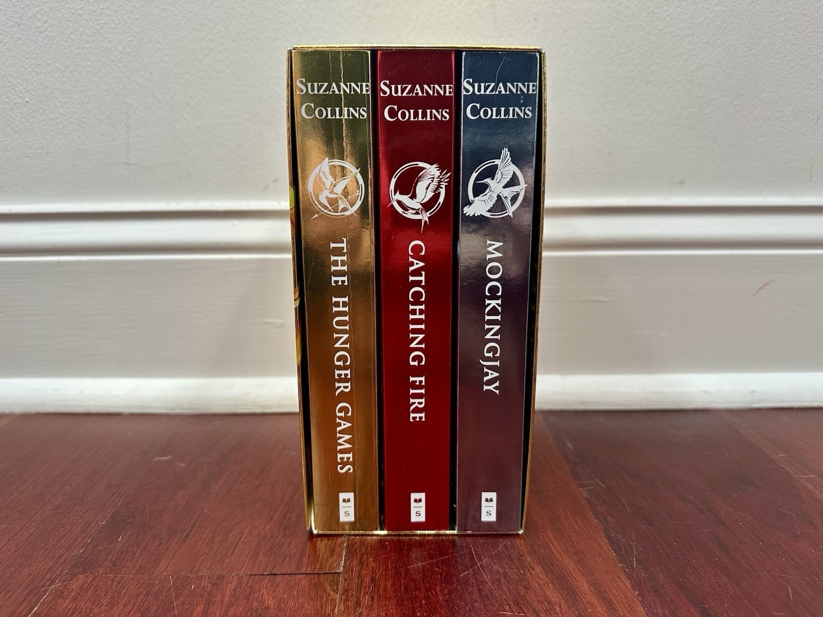 The Hunger Games Box Set: Foil Edition - Paperback Book Set By Suzanne Collins The Hunger Games Box Set: Foil Edition - Paperback Book Set By Suzanne Collins