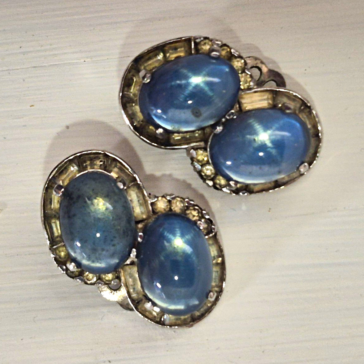 Vintage JOMAZ blue moonstone glass cabochon and rhinestone clip-on earrings.
