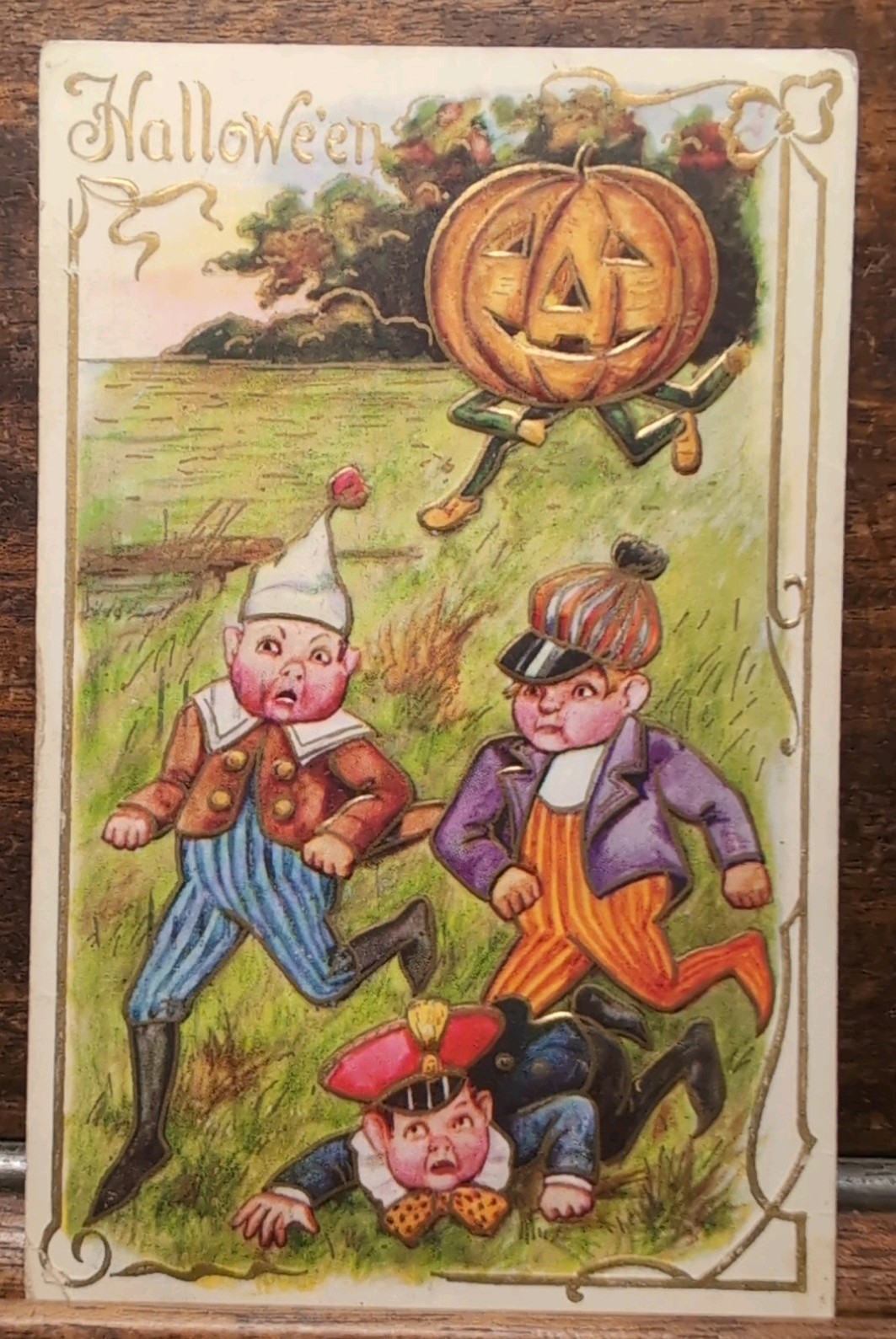 Antique 1909 Embossed Halloween Postcard Jack-O-Lantern Man Chasing Scared Boys