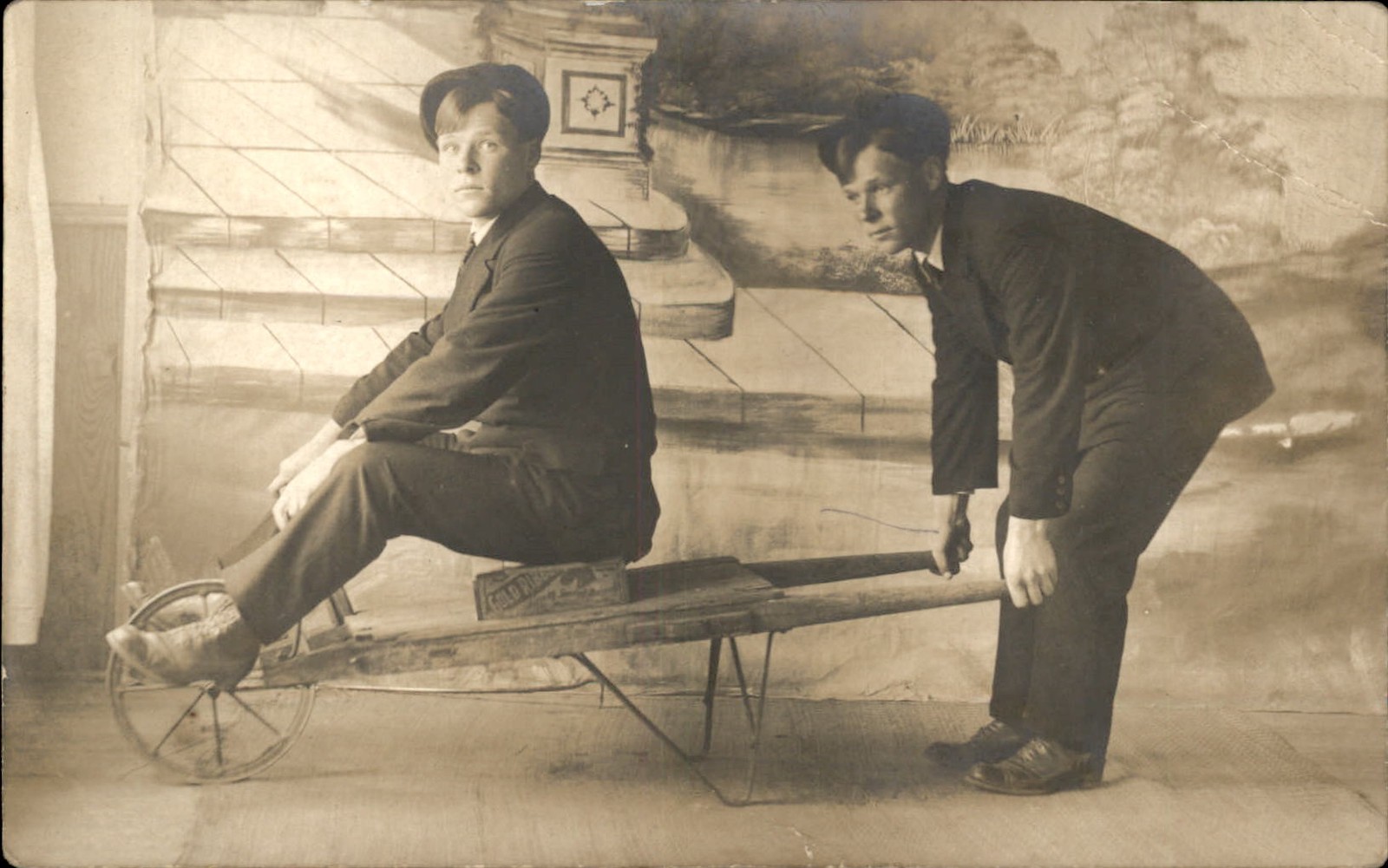 Trick Photography Double Exposure Man on Wheelbarrow c1910s RPPC Postcard bhn