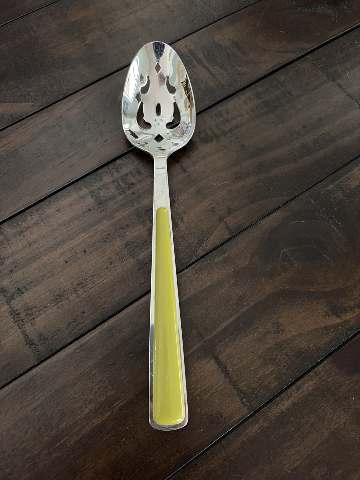 Slotted serving spoon from the Fiesta Merengue flatware set in Lemongrass Green