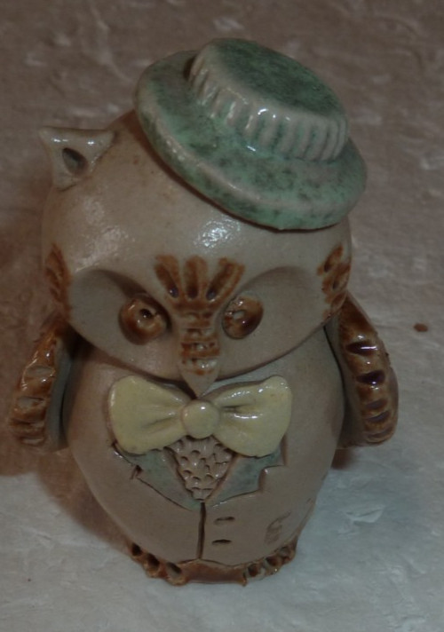 anthropomorphized sandstone owl, topped and costumed signed Antoine Dubois