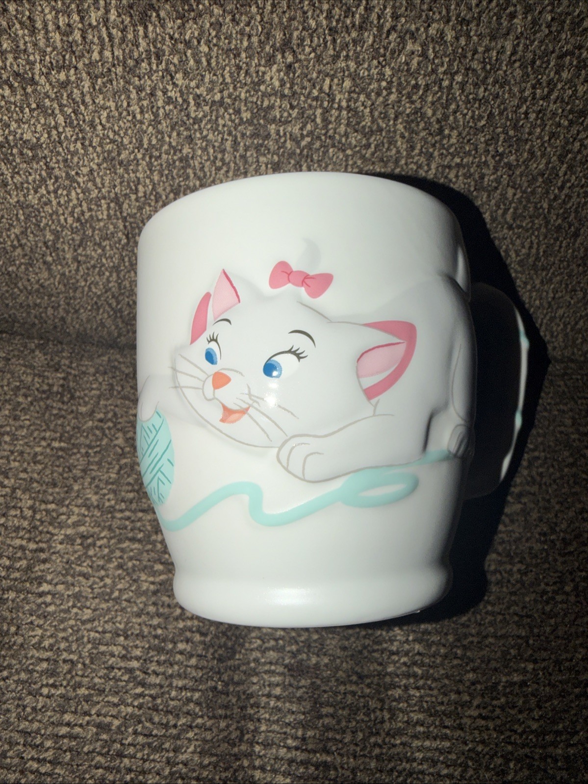 Disney Aristocats Marie Playing Yarn Pawsitively Poised Embossed graphic Mug Disney Aristocats Marie Playing Yarn Pawsitively Poised Embossed graphic Mug