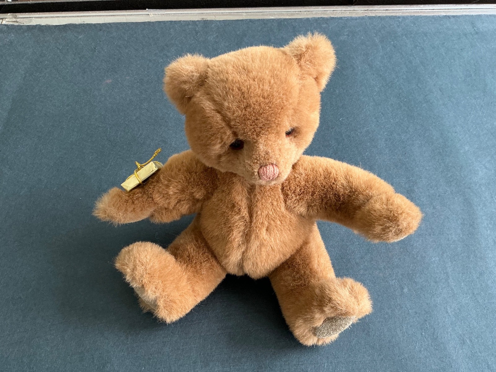 Adorable light brown Gund Teddy Bear. 7” seated lightly used. Gund label on seam