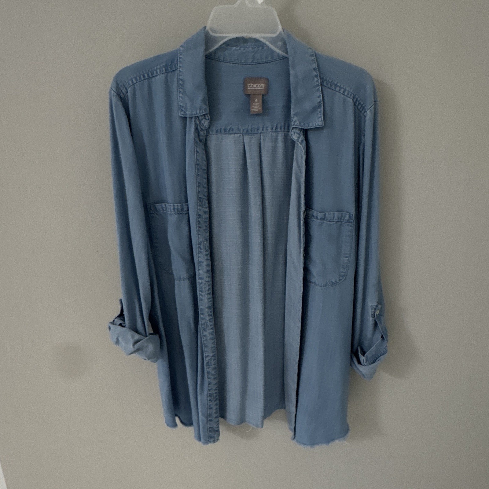 Chico’s Lightweight Denim Button Down Long Sleeve With Cute Frayed Bottom Chico’s Lightweight Denim Button Down Long Sleeve With Cute Frayed Bottom