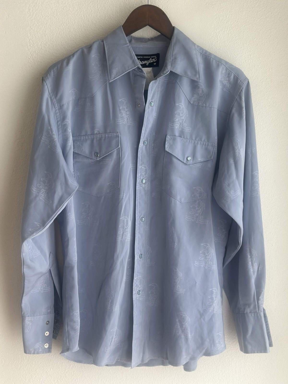 Vintage 90’s light blue Wrangler Western pearl snap shirt bull-riding pattern Vintage 90’s light blue Wrangler Western pearl snap shirt bull-riding pattern