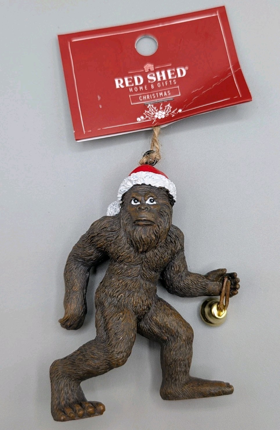 Bigfoot Wearing Santa Hat Walking With Bell Red Shed Ornament NWT 