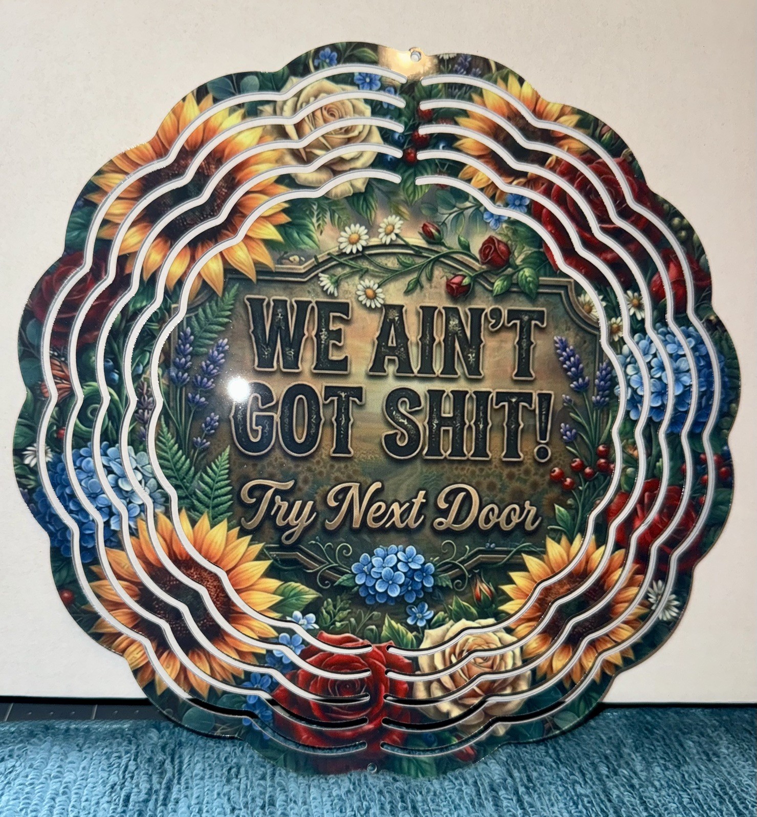 Wind Spinner WE AIN’T GOT S—T   8 inch