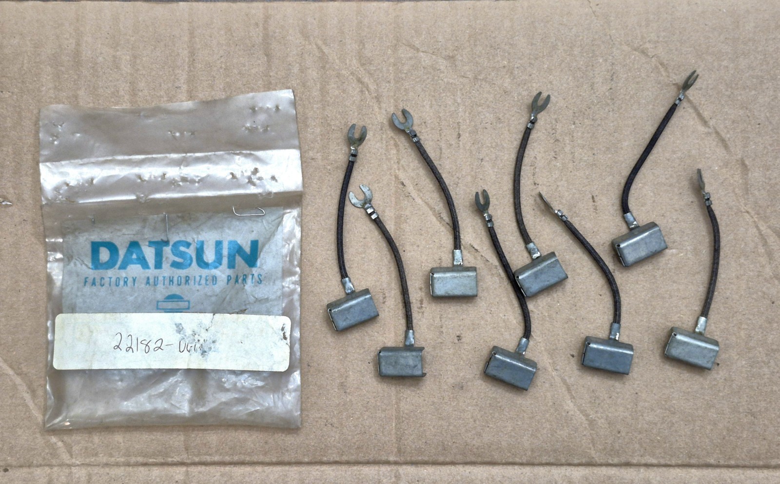 8x NOS OEM Datsun Parts Electrical ?? 22182 - SEE PICS/ READ 