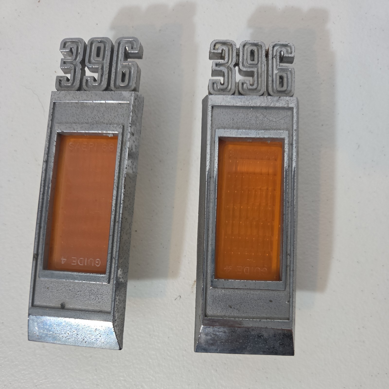 Original 69 Chevy Impala Fender Side Bezels 396 PAIR
