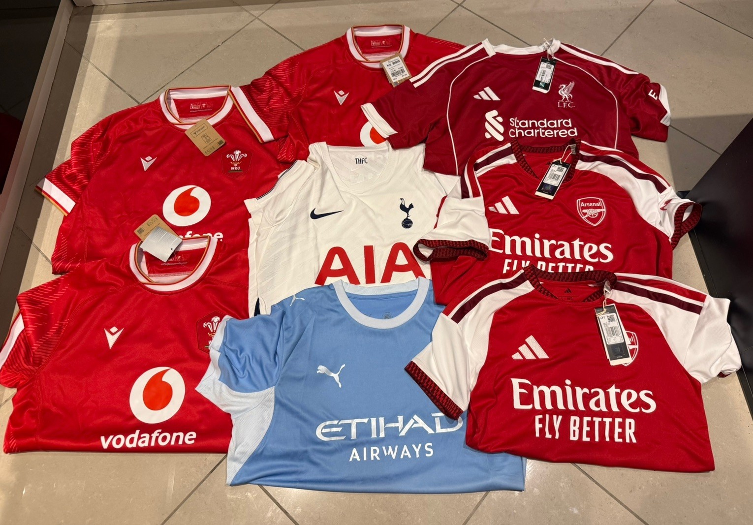 Football Shirts Job Lot Genuine Arsenal Man City Tottenham Liverpool Wales BNWT Football Shirts Job Lot Genuine Arsenal Man City Tottenham Liverpool Wales BNWT